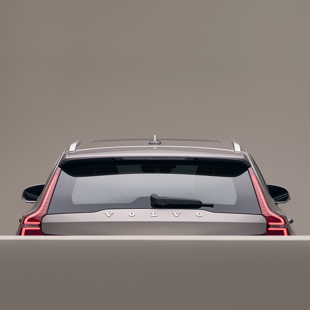 The back exterior of a beige Volvo V60