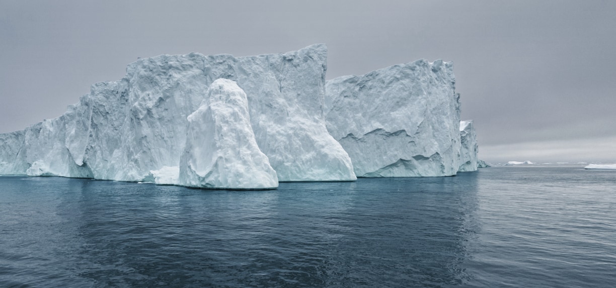 an iceberg with water on the side