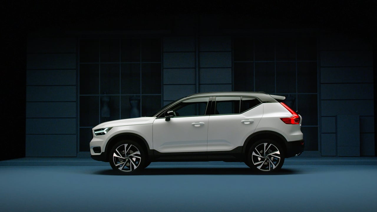 Volvo XC40 in showroom with blue background