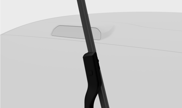 Sliding the new blade into the wiper arm