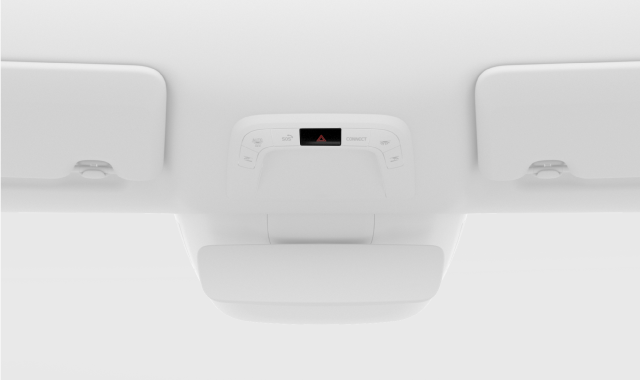 The location of the hazard lights button in the overhead console