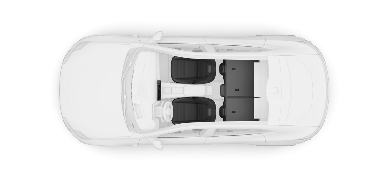A top-down view of the vehicle with folded rear seats