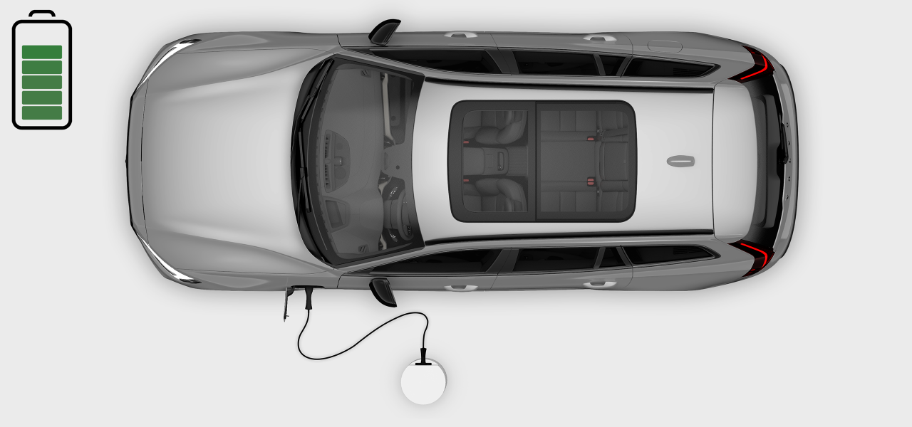 Vista superior de un automóvil cargándose en una estación de carga