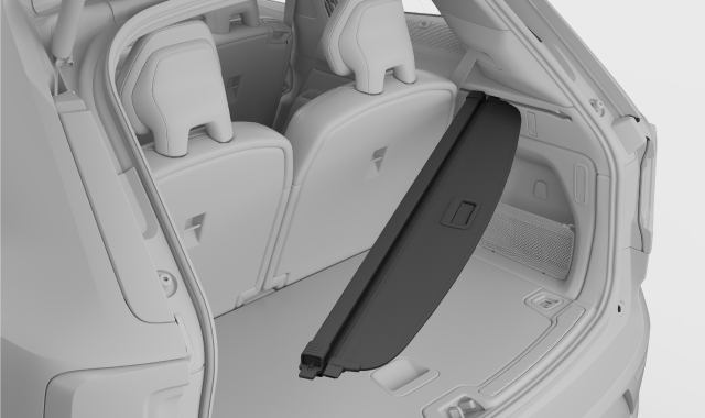 Load cover being positioned into side of boot.