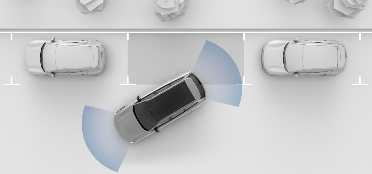 Вид сверху на паркующийся автомобиль.